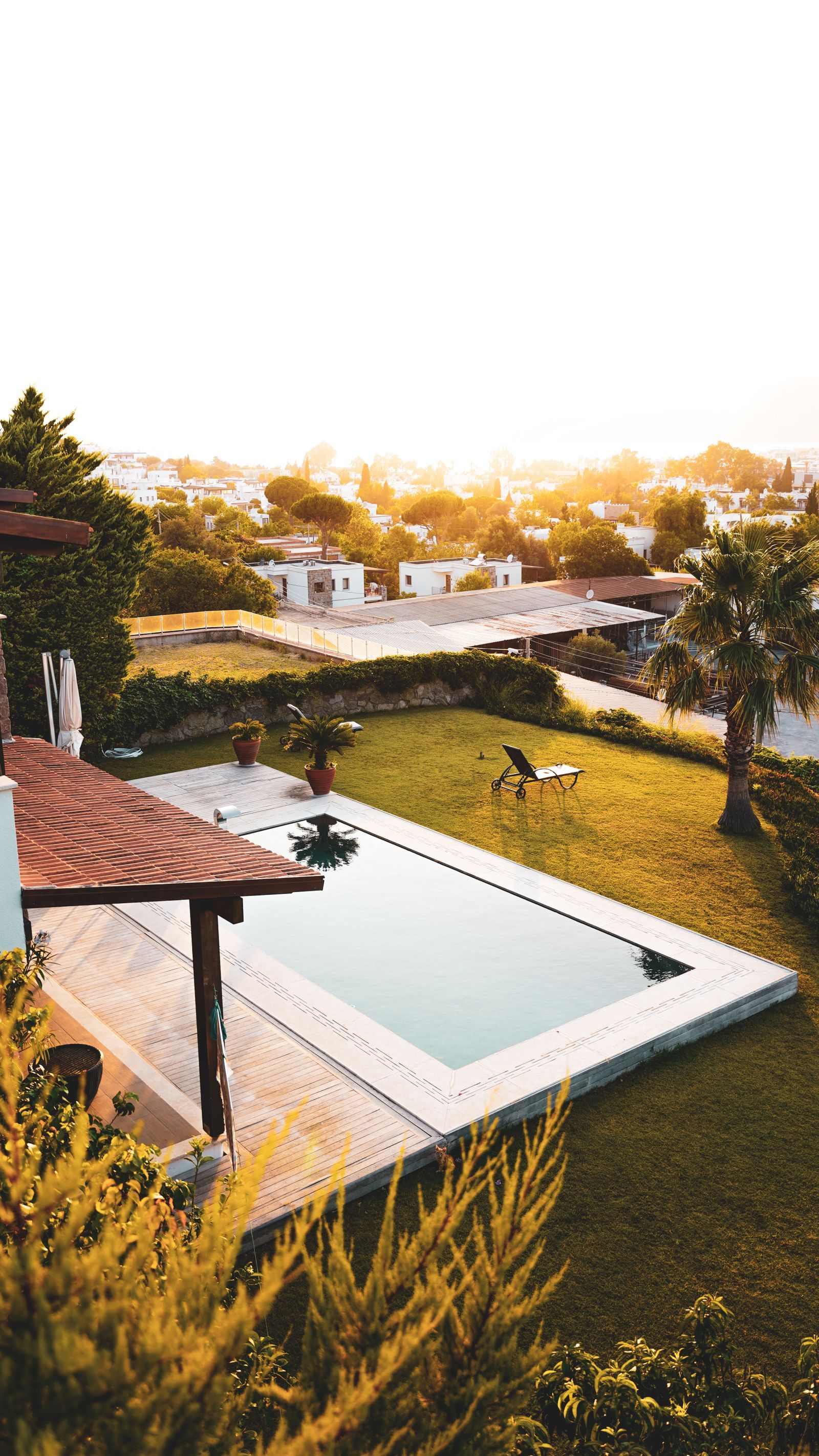 Backyard pool at sunset on a Wedgefield rental property